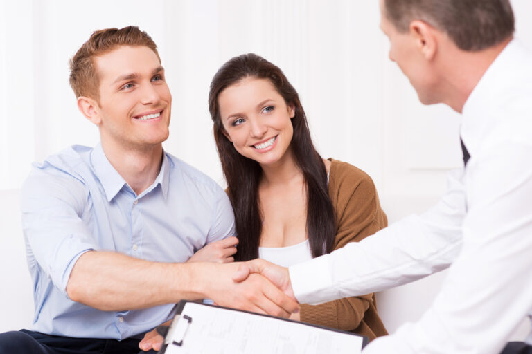 man shaking hand of a real estate agent.