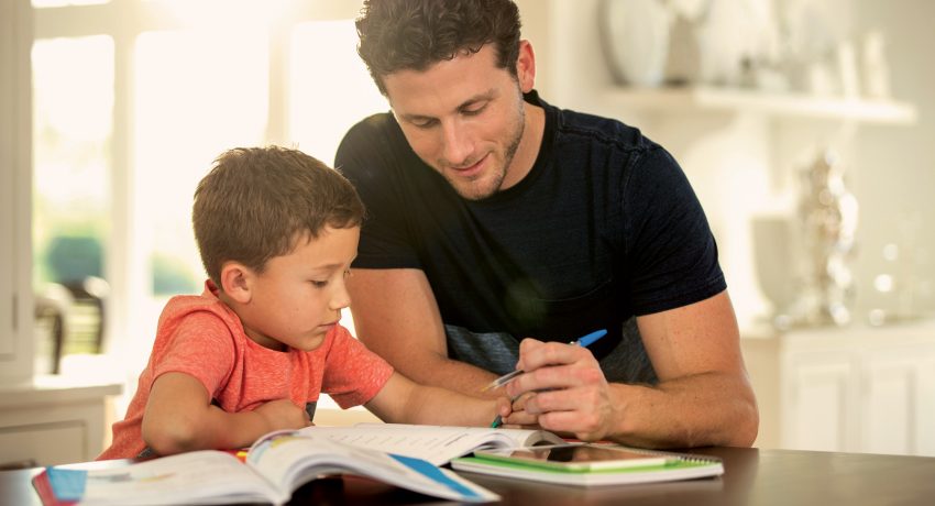 Dad and son doing homework